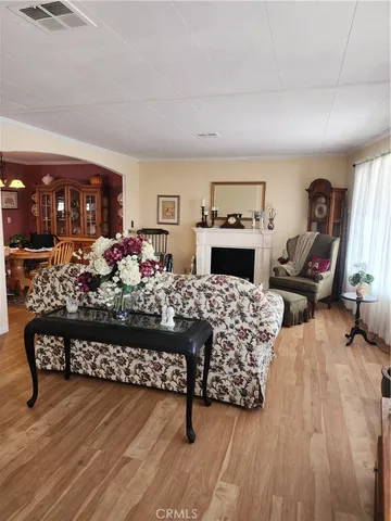 a living room with furniture fireplace and rug