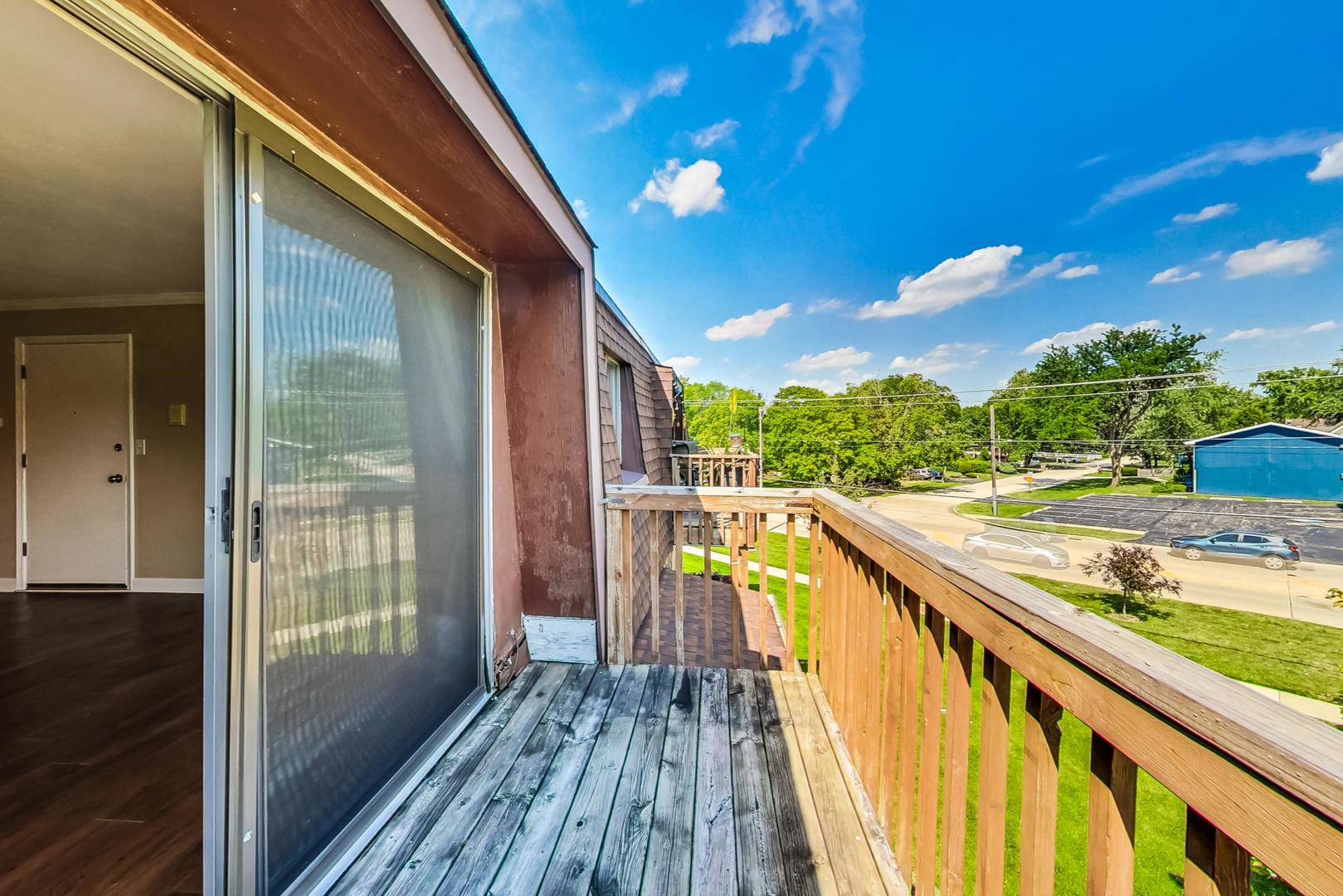 19398 Wolf Road, Unit 11 Mokena, IL 60448 - Photo 23 of 27 a view of balcony with wooden floor and outdoor space