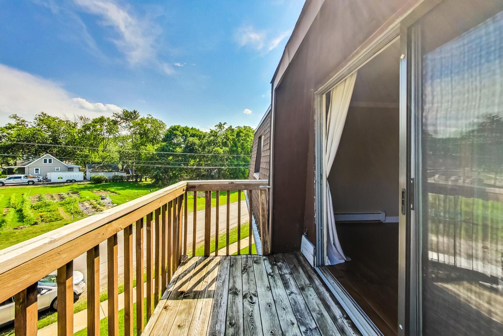 19398 Wolf Road, Unit 11 Mokena, IL 60448 - Photo 24 of 27 a view of balcony with wooden floor