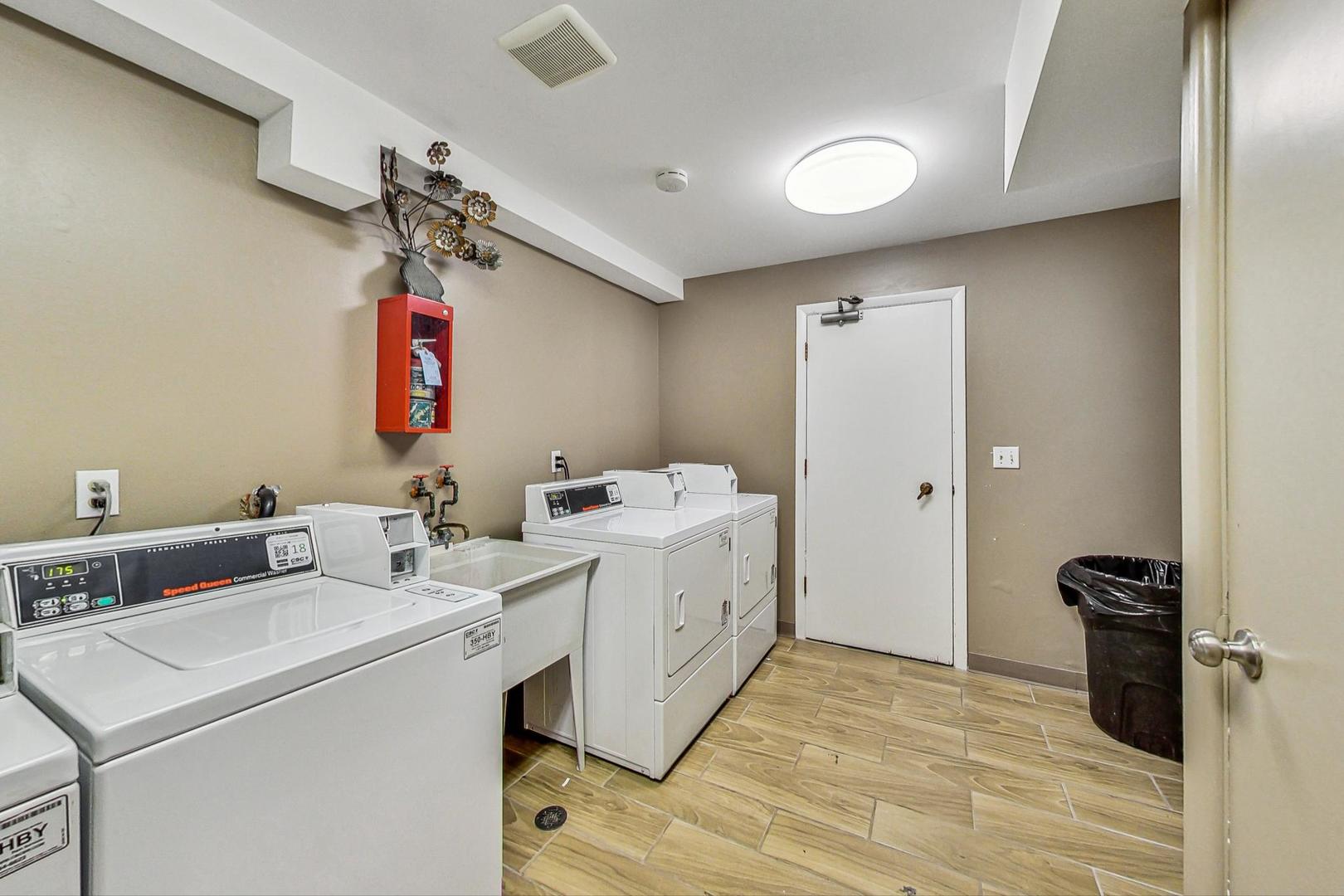 19398 Wolf Road, Unit 11 Mokena, IL 60448 - Photo 25 of 27 a utility room with dryer and washer
