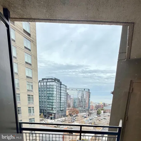 a view of a balcony with a floor to ceiling window