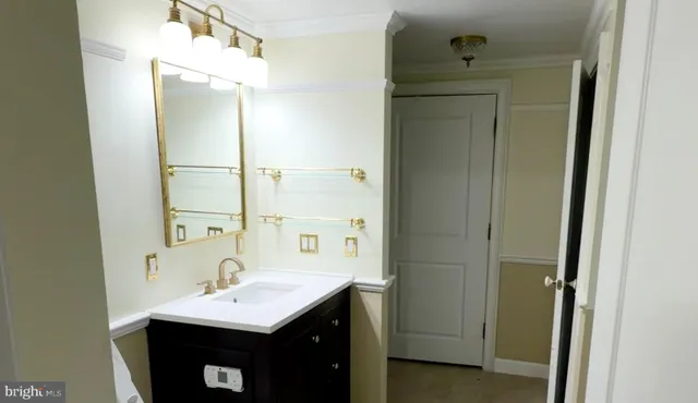 a bathroom with a sink a mirror and a shower