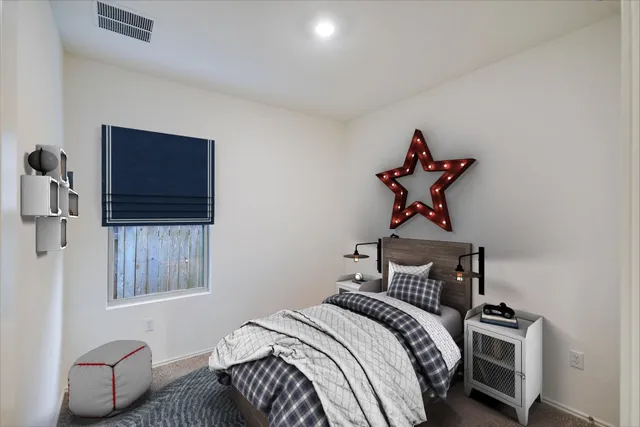 a view of a house with backyard and trees