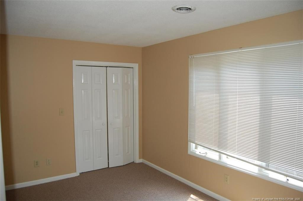 158 Cranes Cove Vass, NC 28394 - Photo 17 of 19 a view of an empty room with a window