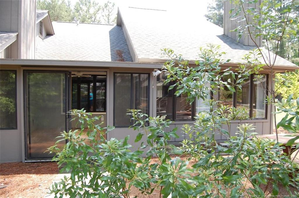 158 Cranes Cove Vass, NC 28394 - Photo 2 of 19 a view of yellow house with potted plants