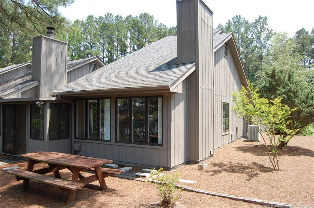 158 Cranes Cove Vass, NC 28394 - Photo 4 of 19 a view of a house with backyard and sitting area