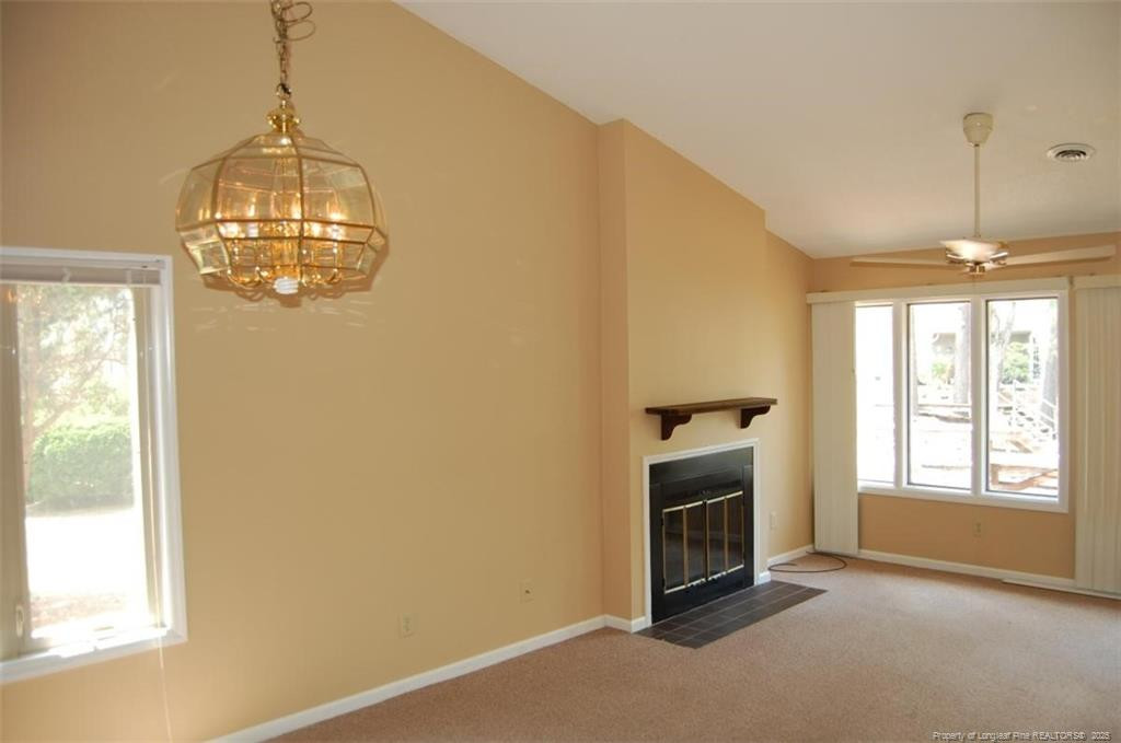 158 Cranes Cove Vass, NC 28394 - Photo 6 of 19 a view of a livingroom with a chandelier fireplace and window