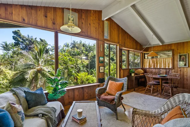 a table and chairs with the umbrella in the patio