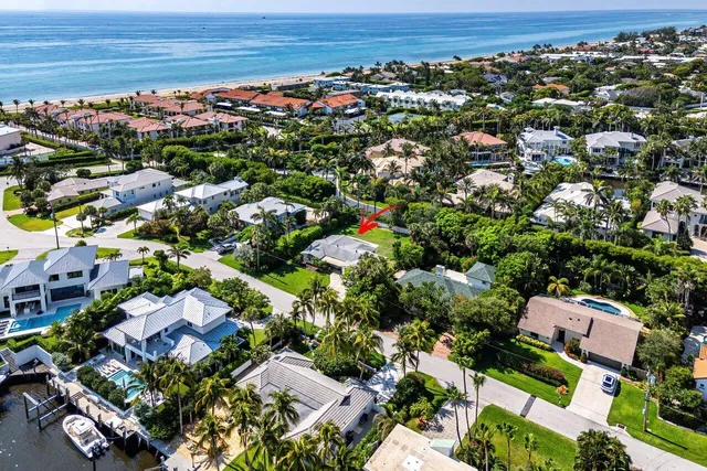 an aerial view of residential houses with outdoor space