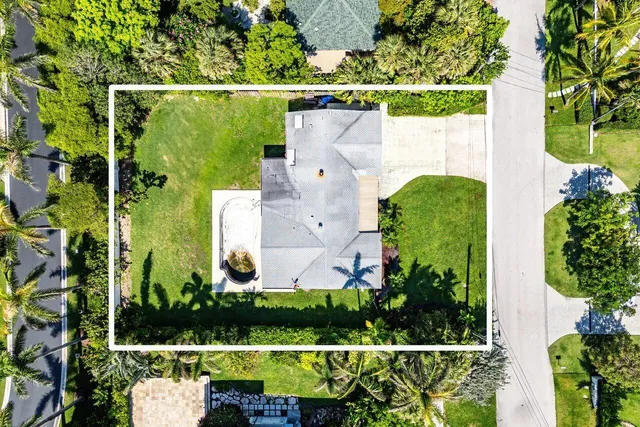 an aerial view of a house with a garden and plants