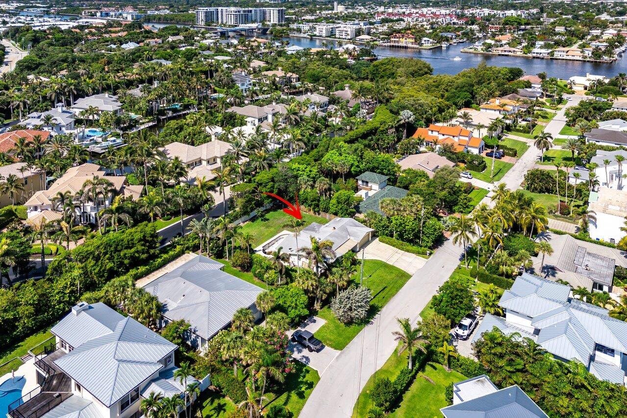 19 Harbour Drive South Ocean Ridge, FL 33435 - Photo 7 of 9 an aerial view of a house with a yard and lake view