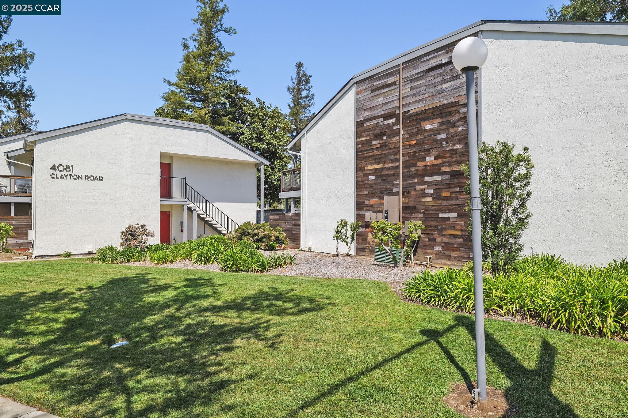 4081 Clayton Road, Unit 328 Concord, CA 94521 - Photo 1 of 1 a front view of a house with garden
