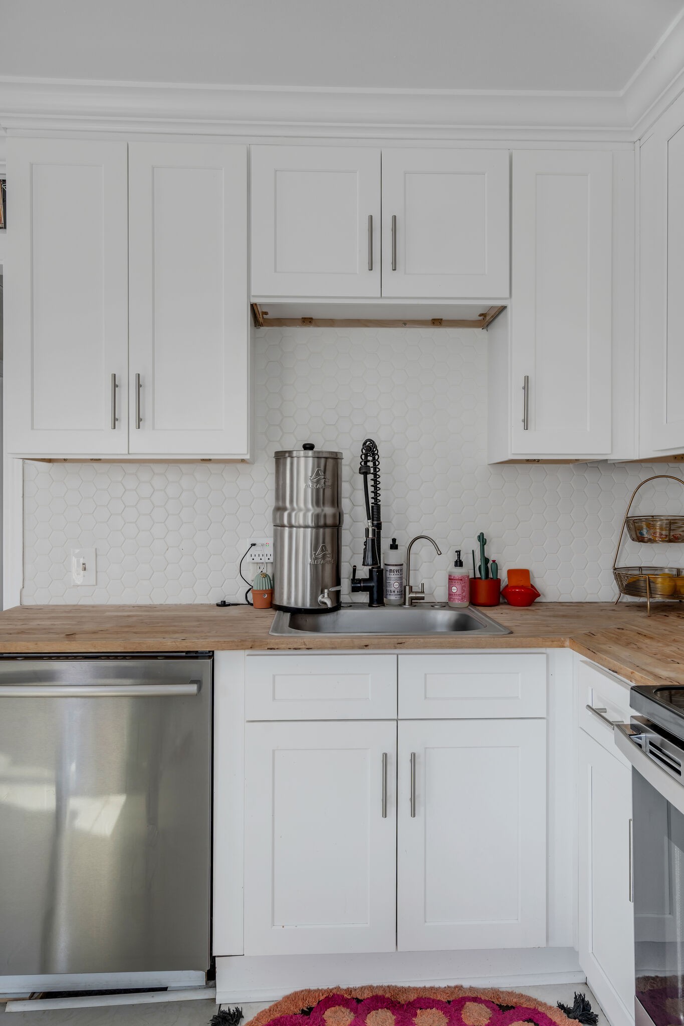 911 South 14th Street Nashville, TN 37206 - Photo 11 of 30 a kitchen with white cabinets and sink