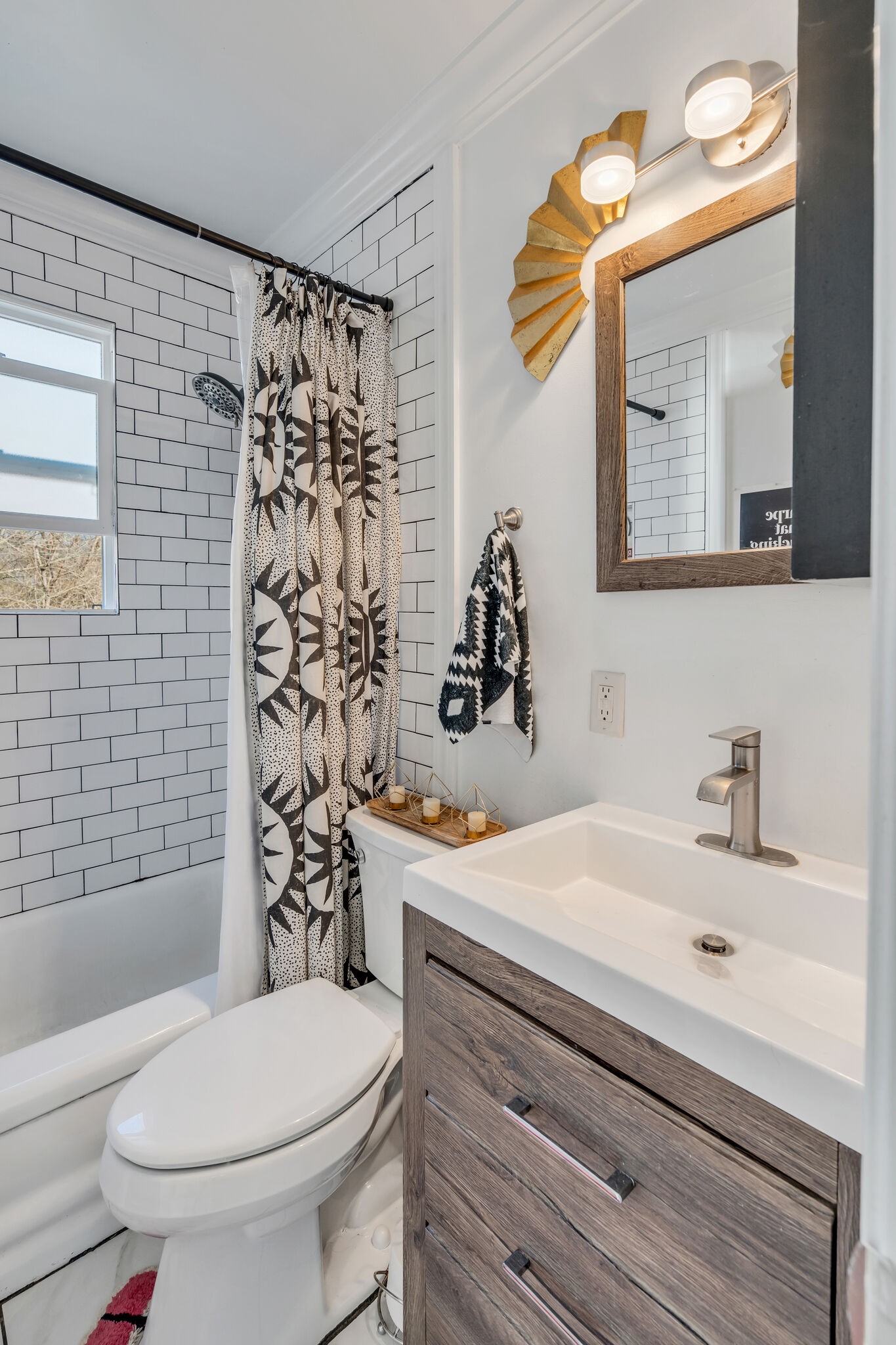 911 South 14th Street Nashville, TN 37206 - Photo 22 of 30 a bathroom with a sink a toilet and shower curtain