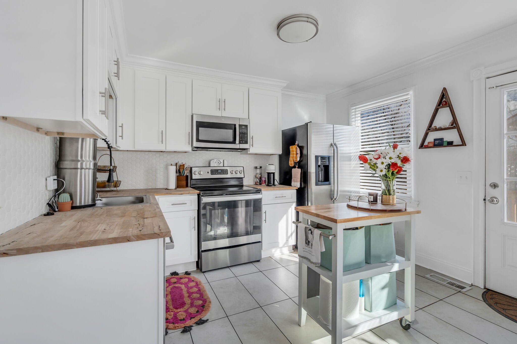 911 South 14th Street Nashville, TN 37206 - Photo 9 of 30 a kitchen with a sink appliances and cabinets