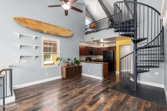 a view of a living room and a wooden floor