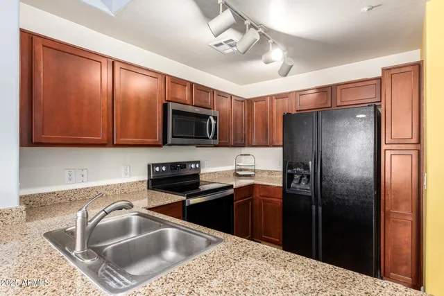a view of a kitchen with furniture and a window