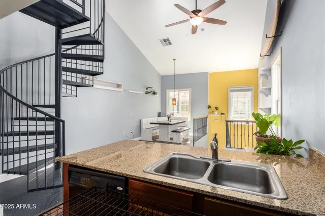 a kitchen with a sink stainless steel appliances and cabinets