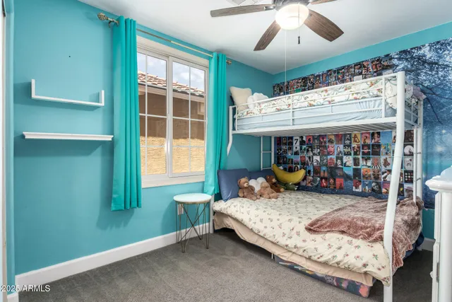 a bathroom with a granite countertop sink toilet and mirror