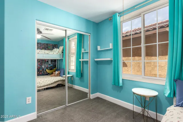 a bathroom with a granite countertop bathtub shower and toilet