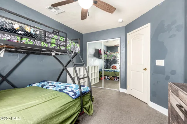 a bathroom with a toilet a sink and a mirror