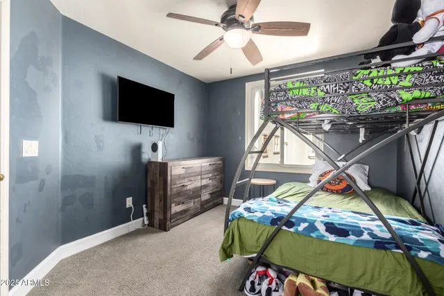 a bedroom with furniture and a window