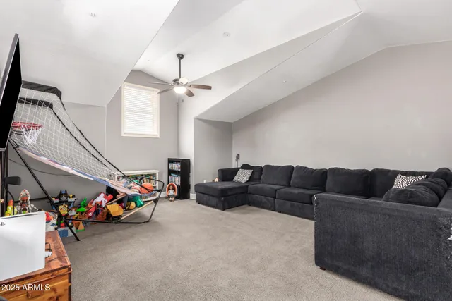 a view of living room with furniture and wooden floor