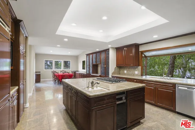 a view of living room with granite countertop furniture and a kitchen
