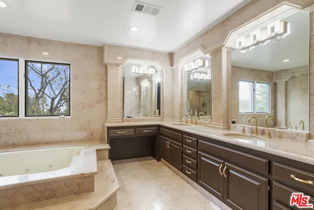a bathroom with a bathtub and shower