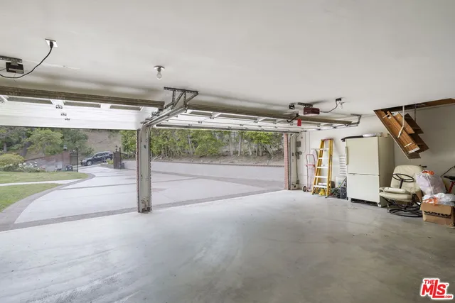 a view of a patio with a table and chairs