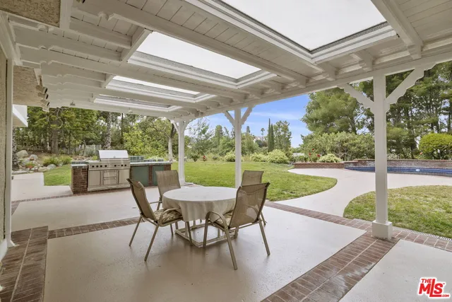 an aerial view of a house with garden space