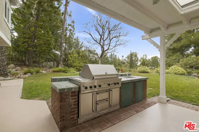 an aerial view of residential house with outdoor space and parking
