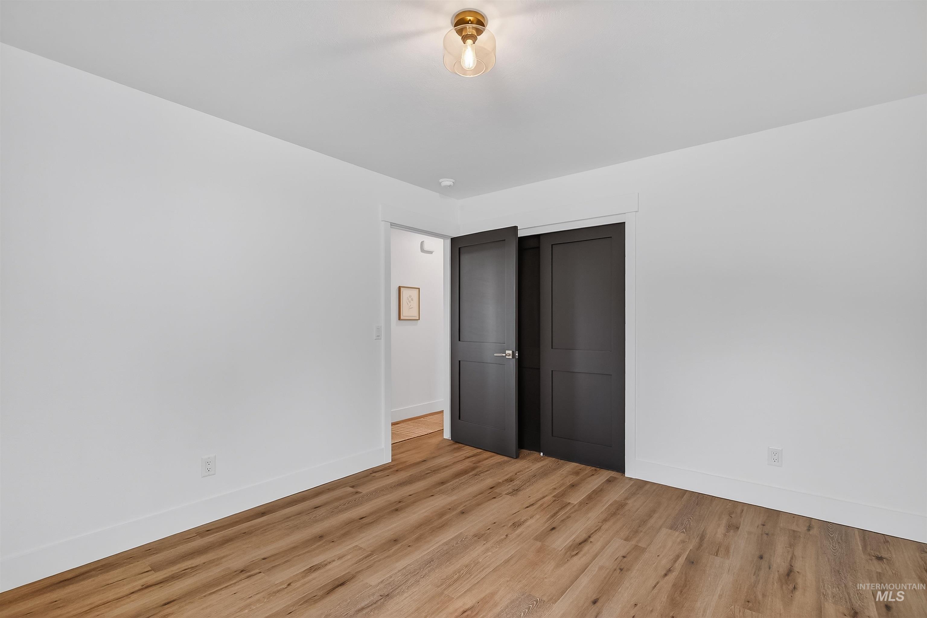 3513 8th Street Lewiston, ID 83501 - Photo 31 of 41 Unfurnished bedroom with a closet and light wood-style flooring