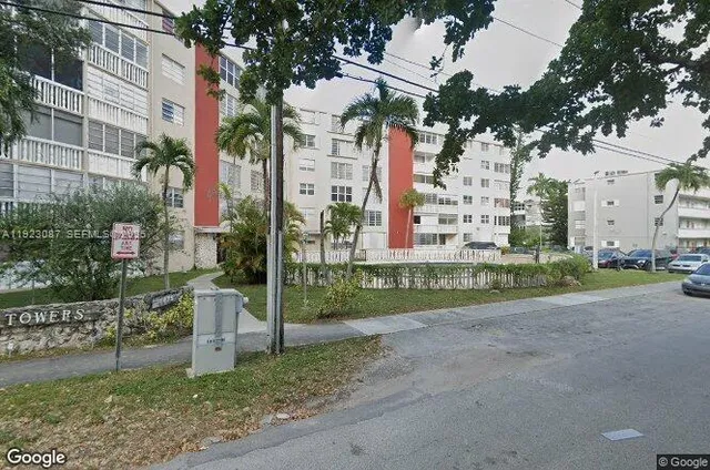 a view of a building with a yard