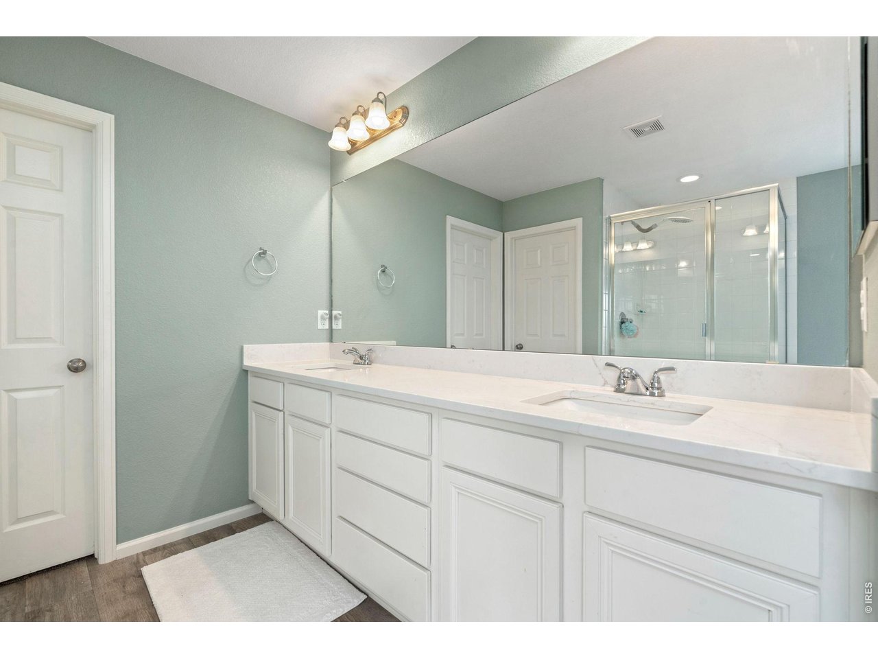 5259 Odessa Lake Street Timnath, CO 80547 - Photo 14 of 30 a bathroom with a sink and a mirror