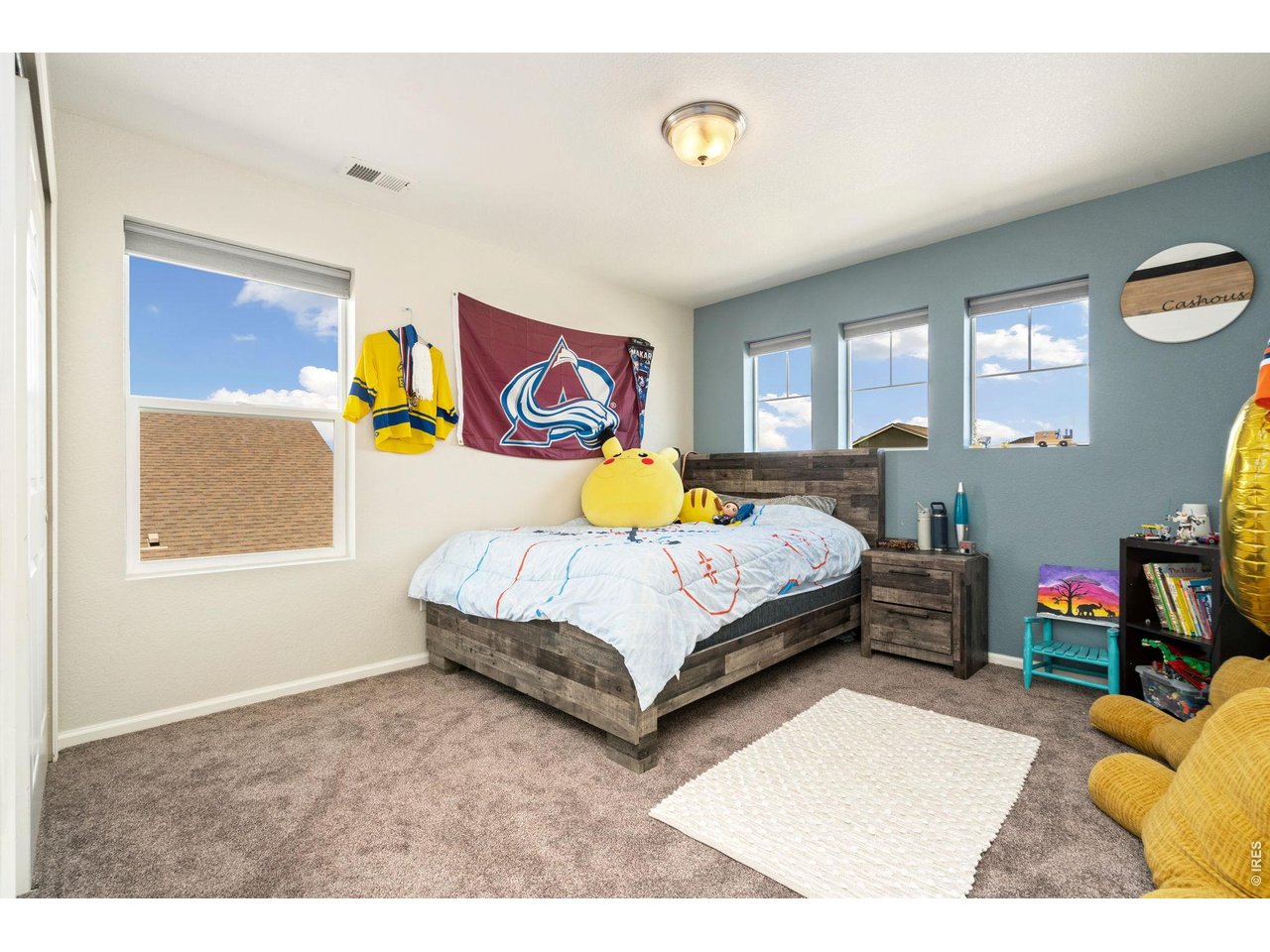 5259 Odessa Lake Street Timnath, CO 80547 - Photo 20 of 30 a bedroom with a bed and a window