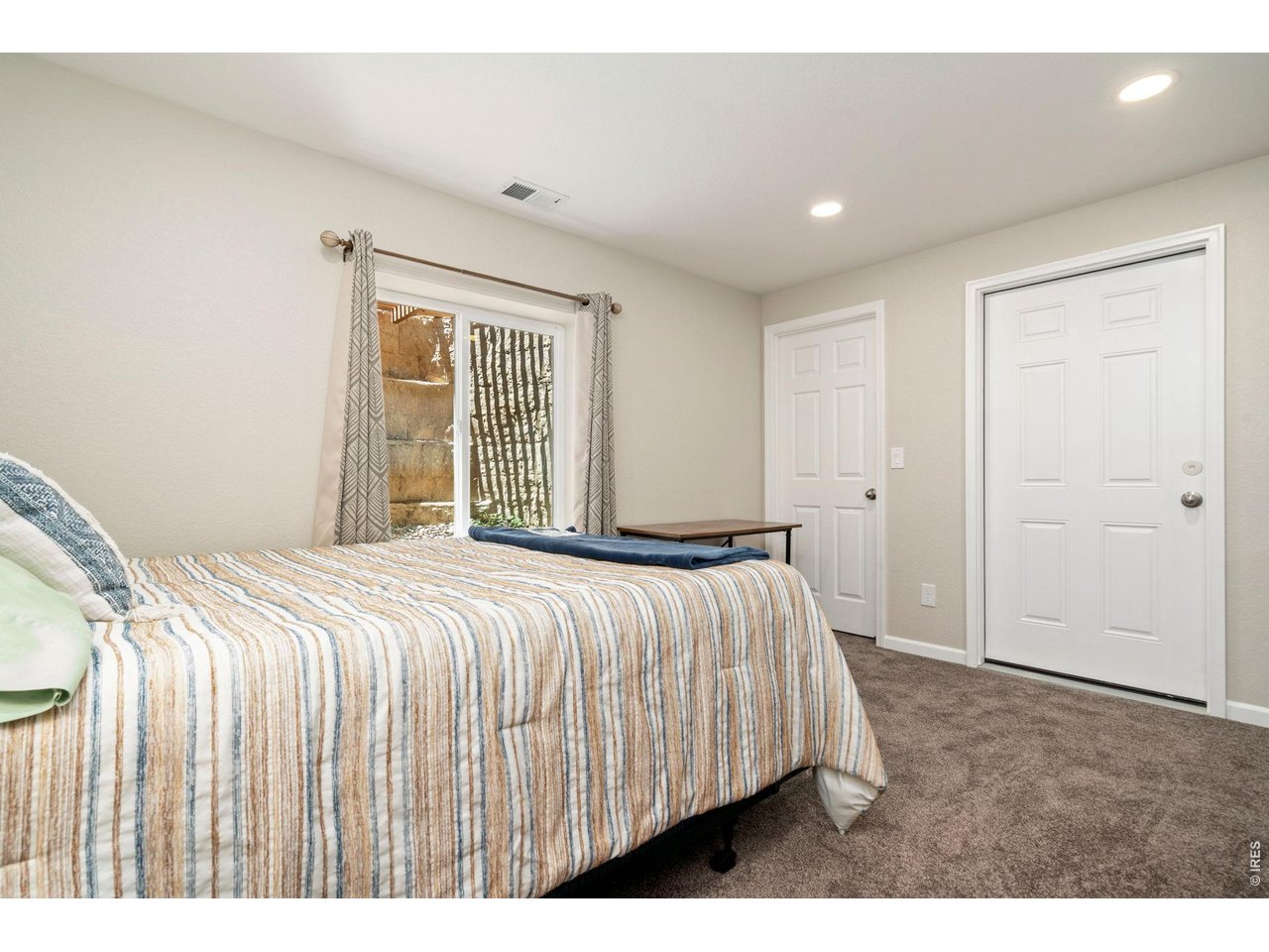 5259 Odessa Lake Street Timnath, CO 80547 - Photo 22 of 30 a bed sitting in a spacious bedroom next to a window