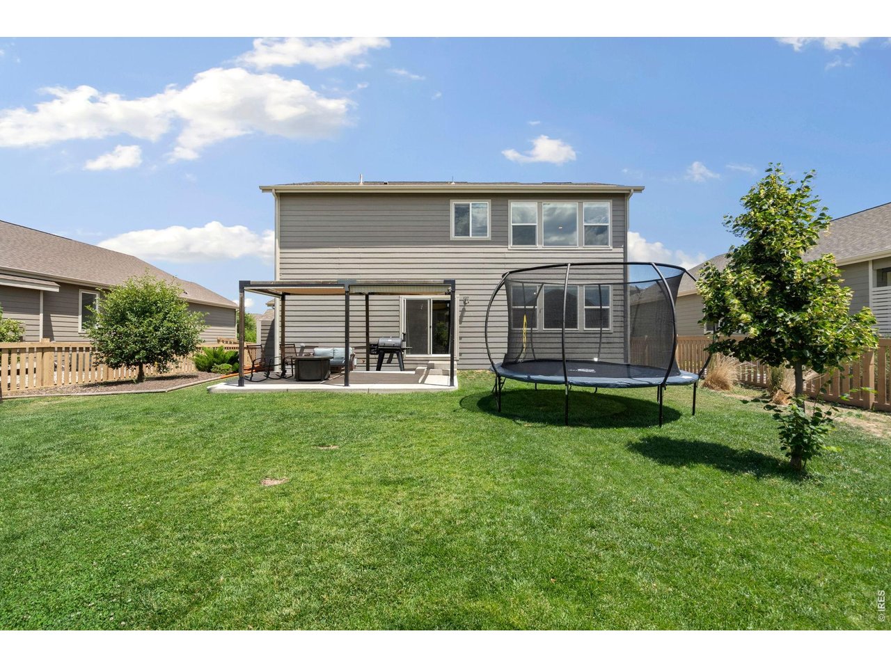 5259 Odessa Lake Street Timnath, CO 80547 - Photo 27 of 30 a view of a house with a backyard