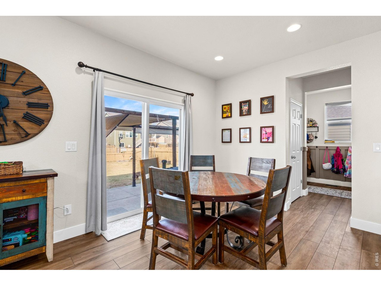 5259 Odessa Lake Street Timnath, CO 80547 - Photo 8 of 30 a view of a dining room with furniture and wooden floor