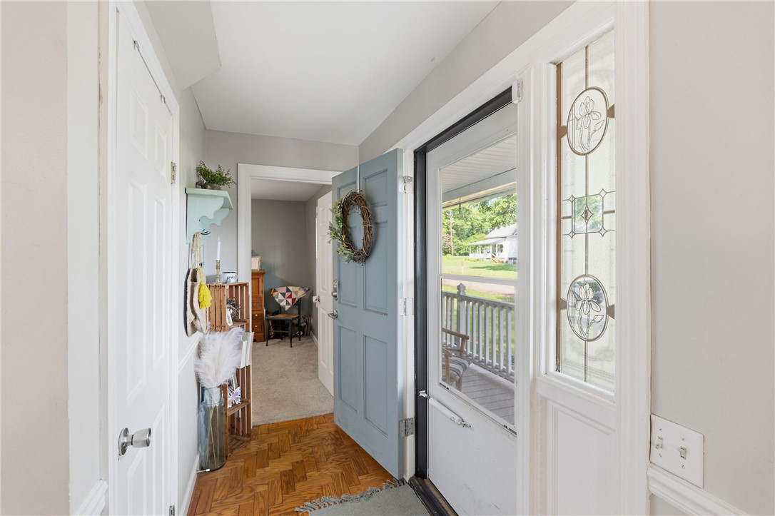 108 Tarrant Street Central, SC 29630 - Photo 6 of 42 A welcoming entry, with a wooden parquet floor, opens to a front porch and sun-filled views.
