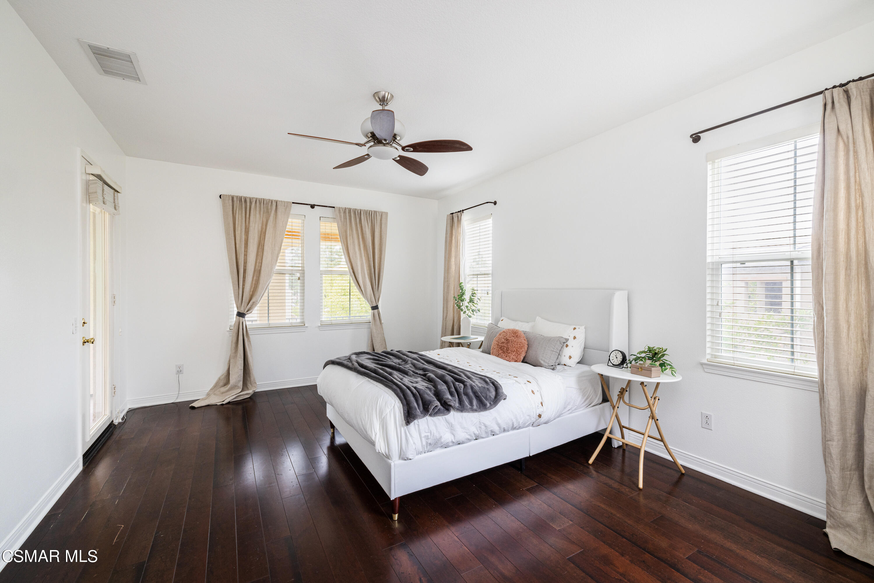 110 Park Hill Road Simi Valley, CA 93065 - Photo 18 of 36 a bedroom with a bed and wooden floor
