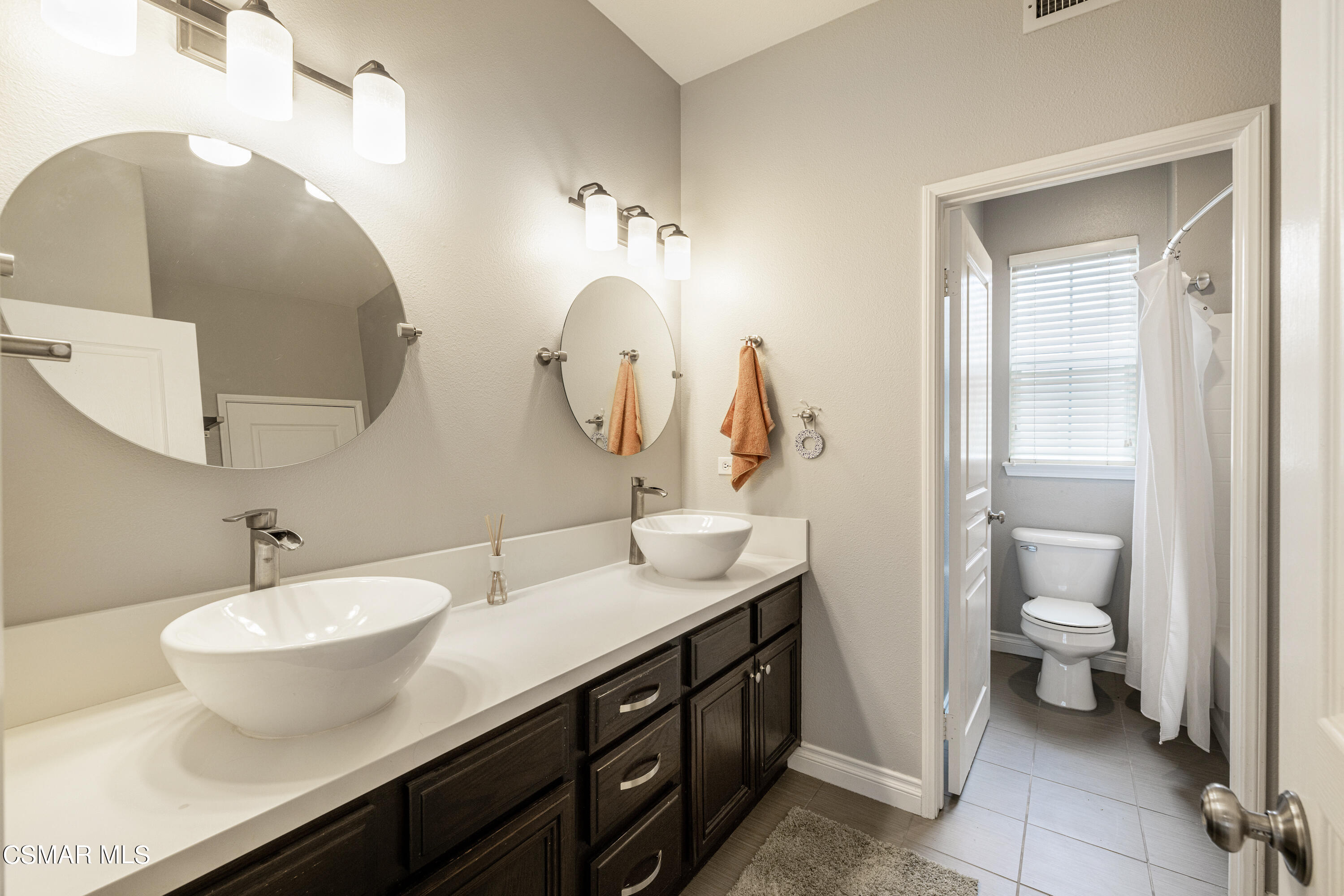 110 Park Hill Road Simi Valley, CA 93065 - Photo 28 of 36 a bathroom with a double vanity sink and a mirror
