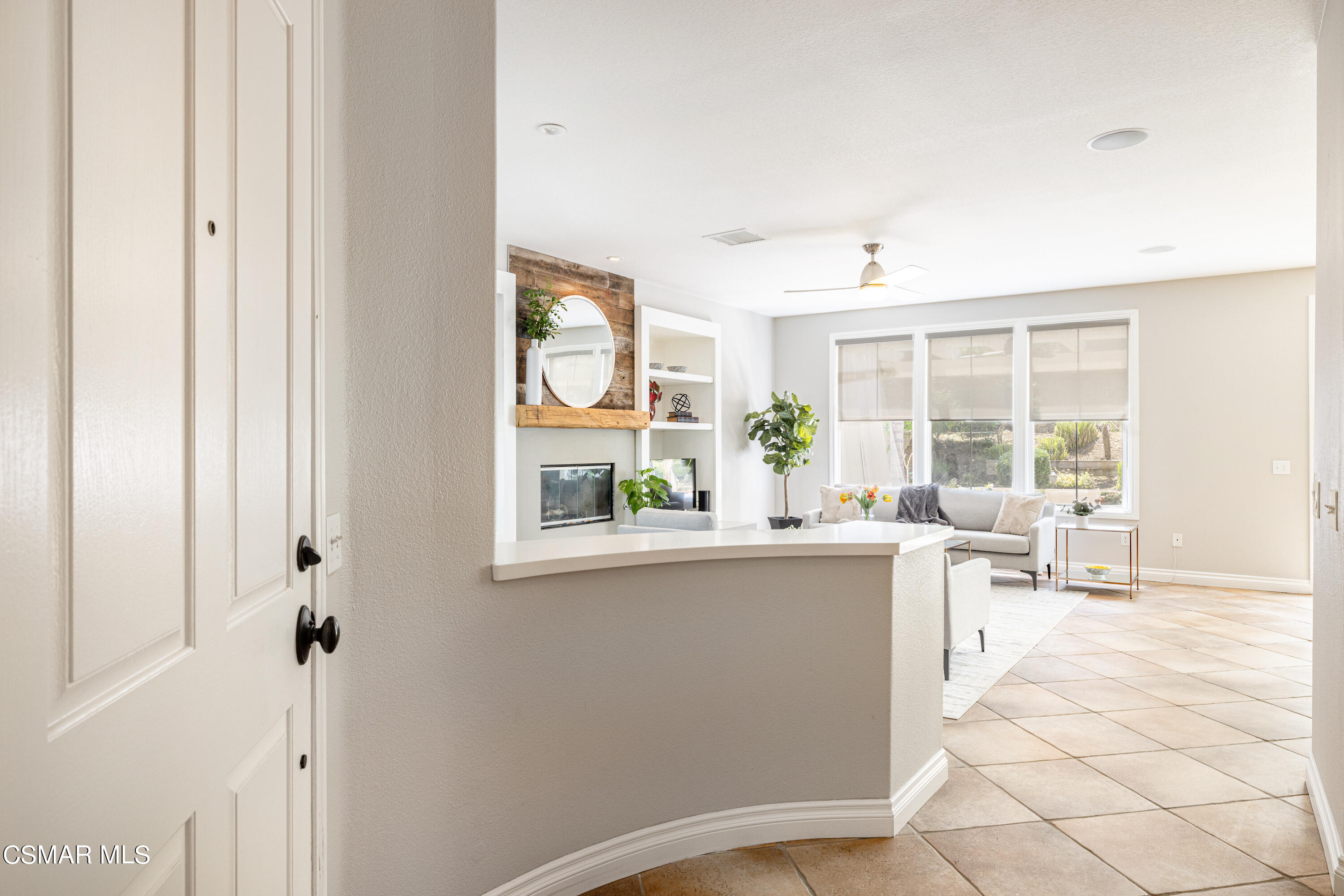 110 Park Hill Road Simi Valley, CA 93065 - Photo 6 of 36 a living room with stainless steel appliances furniture a large window and a refrigerator