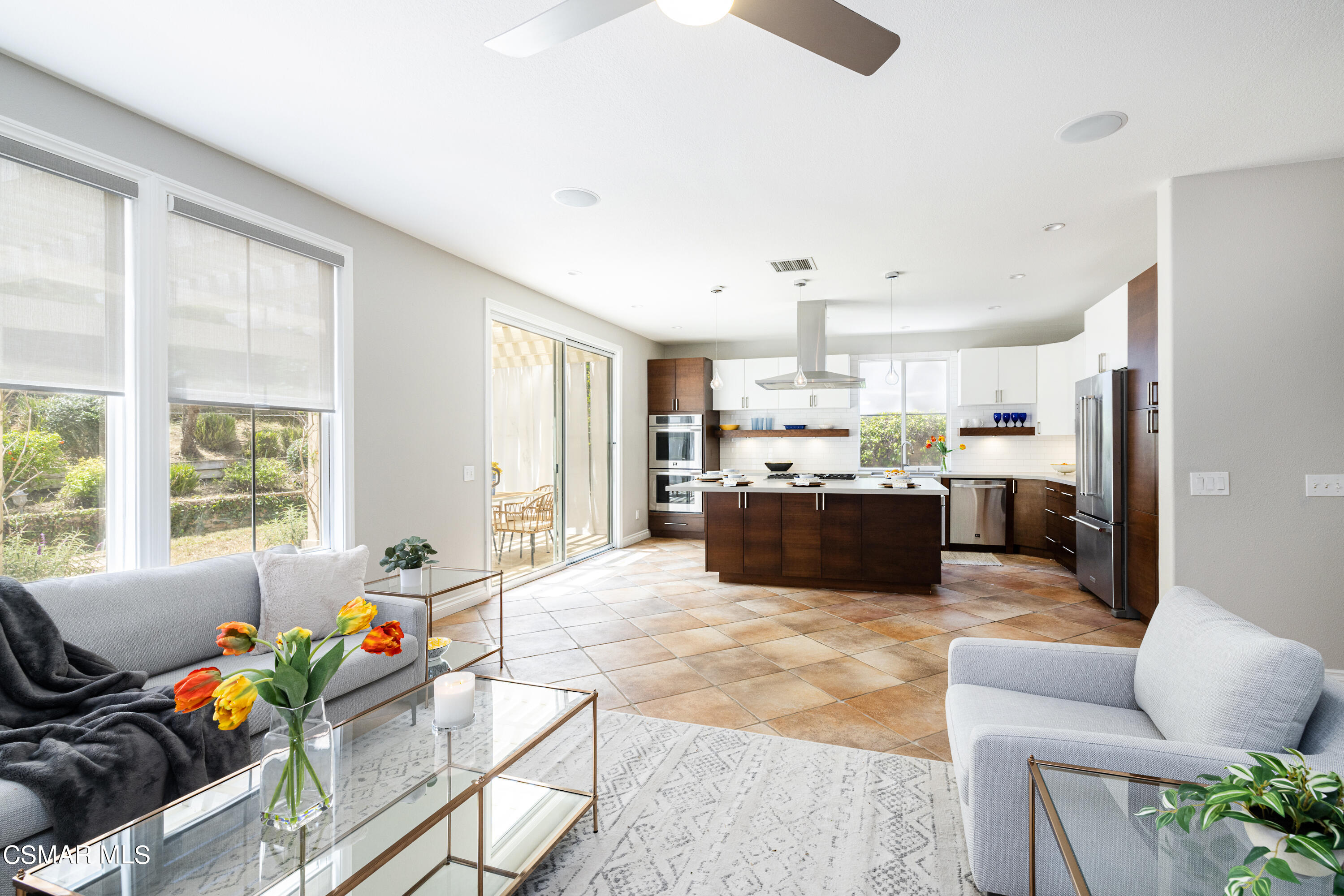 110 Park Hill Road Simi Valley, CA 93065 - Photo 10 of 36 a kitchen with stainless steel appliances kitchen island granite countertop a refrigerator and a sink