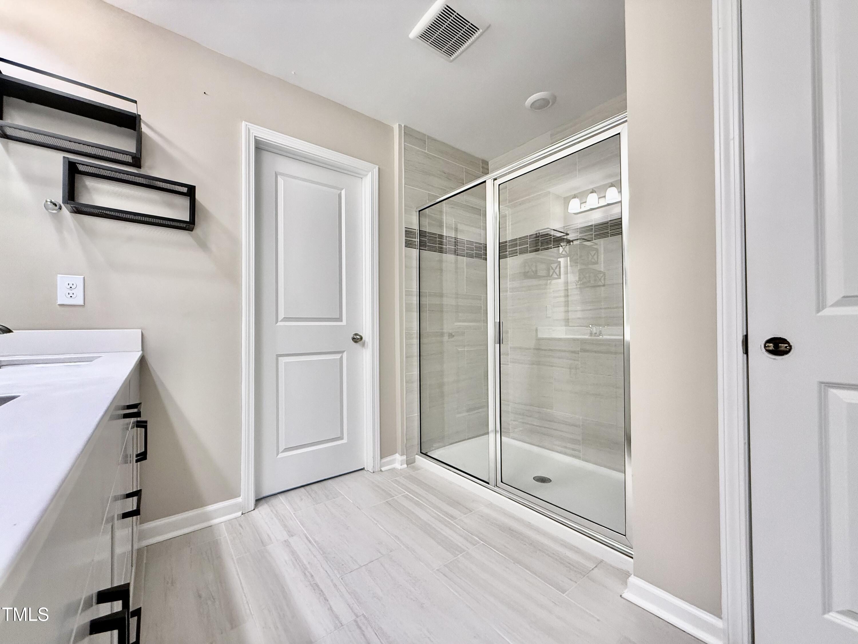 3904 Leeson Trail Raleigh, NC 27616 - Photo 29 of 43 a bathroom with a shower
