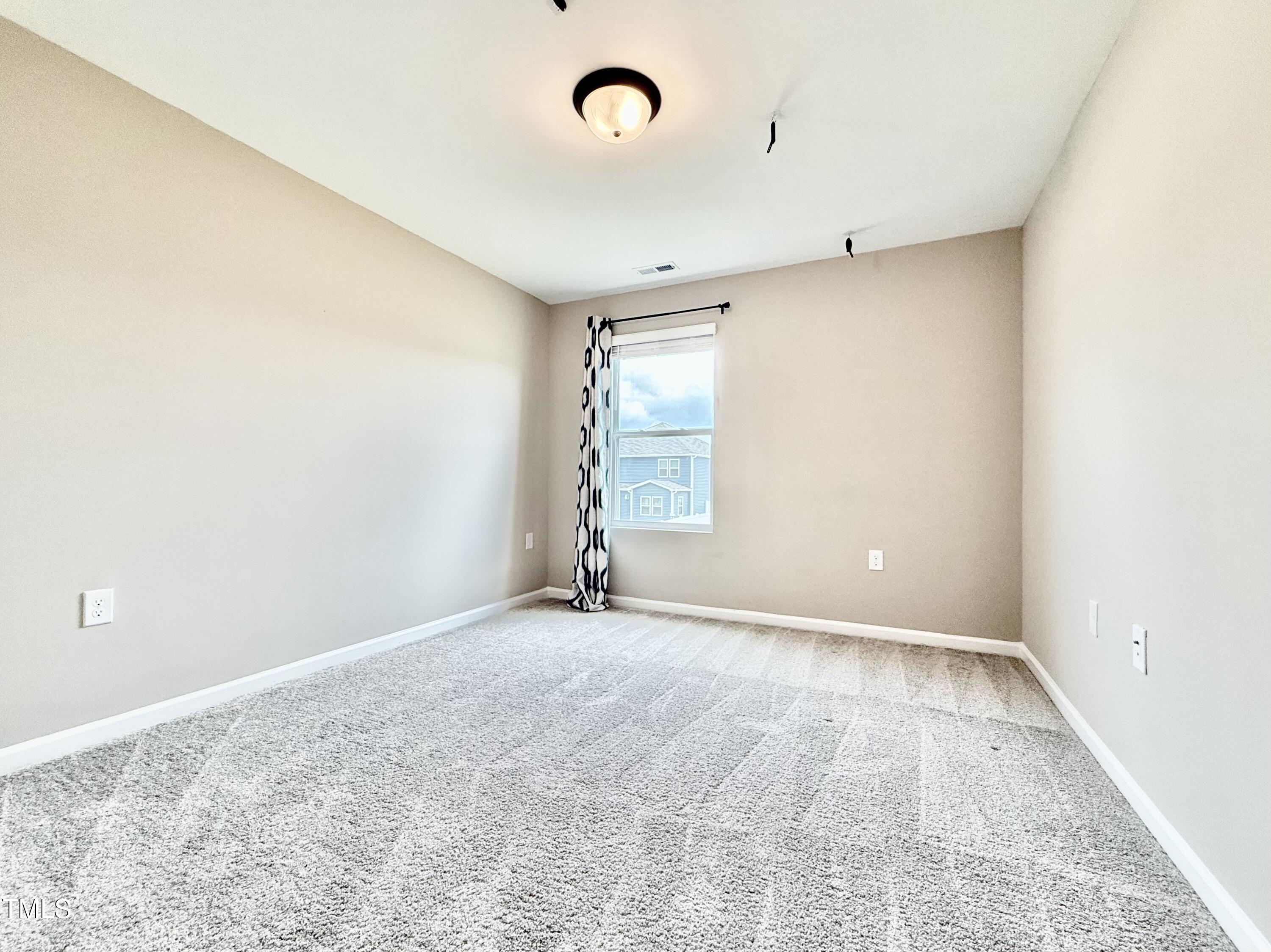 3904 Leeson Trail Raleigh, NC 27616 - Photo 36 of 43 an empty room with windows