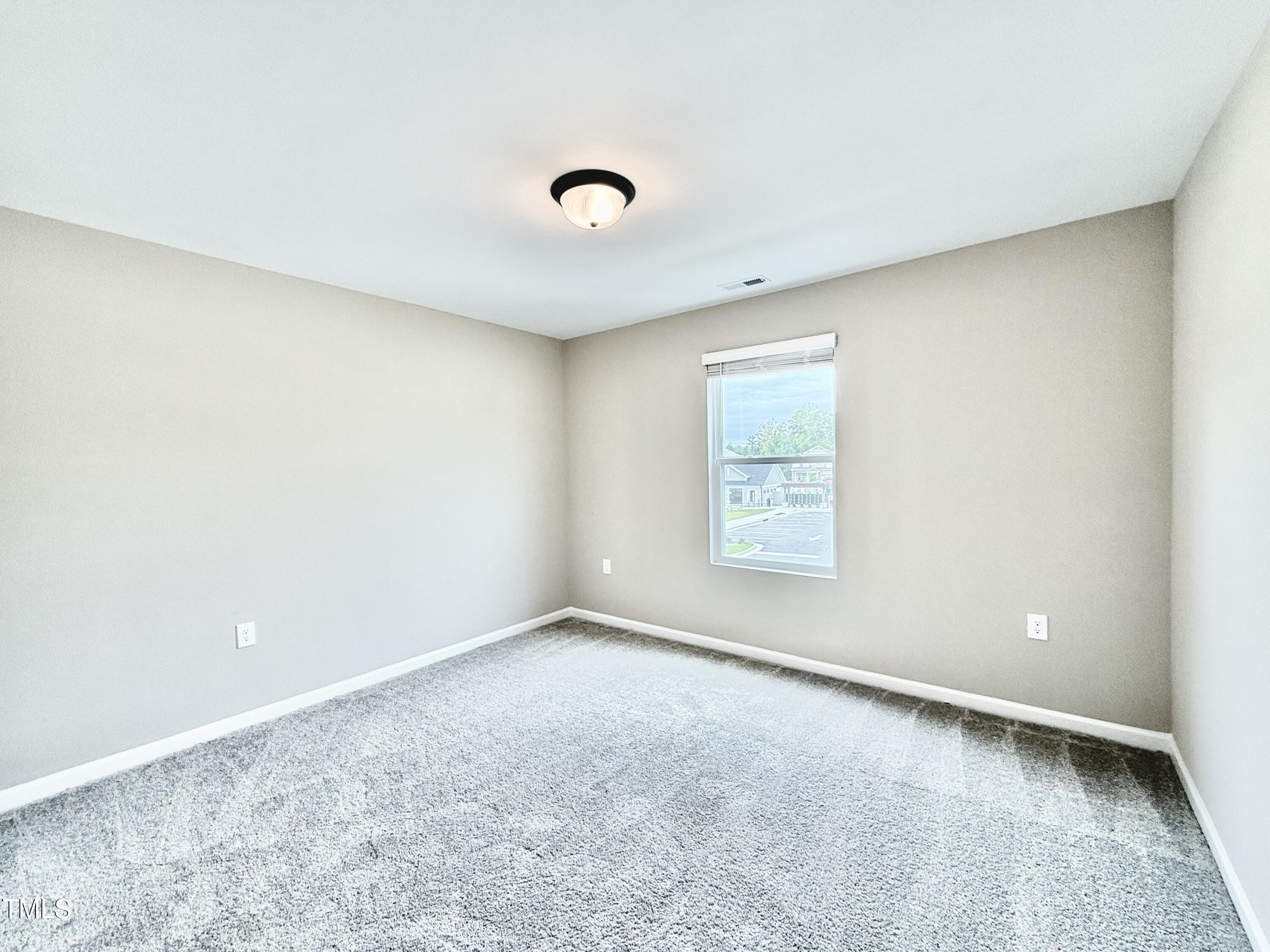 3904 Leeson Trail Raleigh, NC 27616 - Photo 38 of 43 an empty room with a empty space and windows