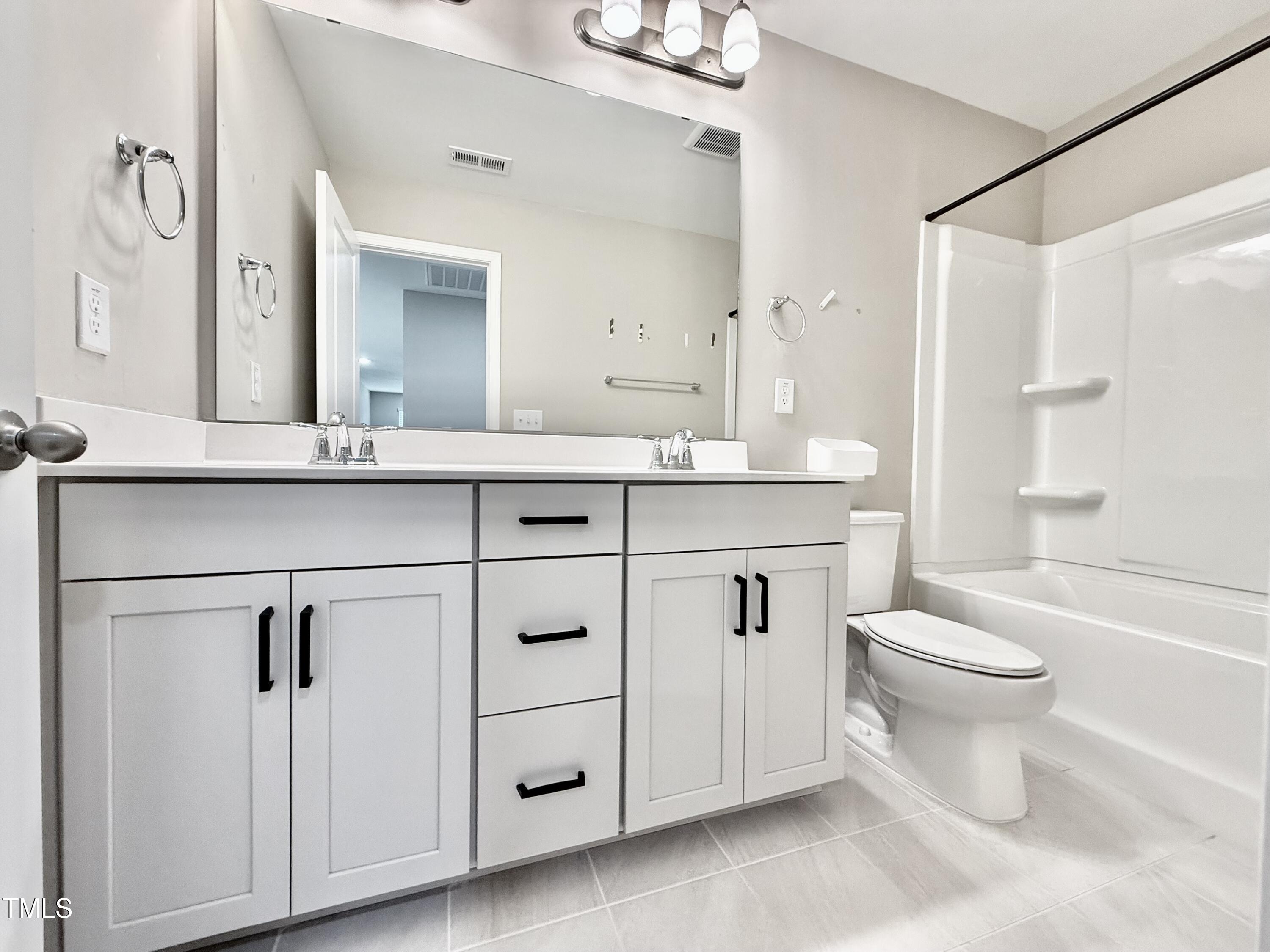 3904 Leeson Trail Raleigh, NC 27616 - Photo 39 of 43 a bathroom with a sink toilet and shower