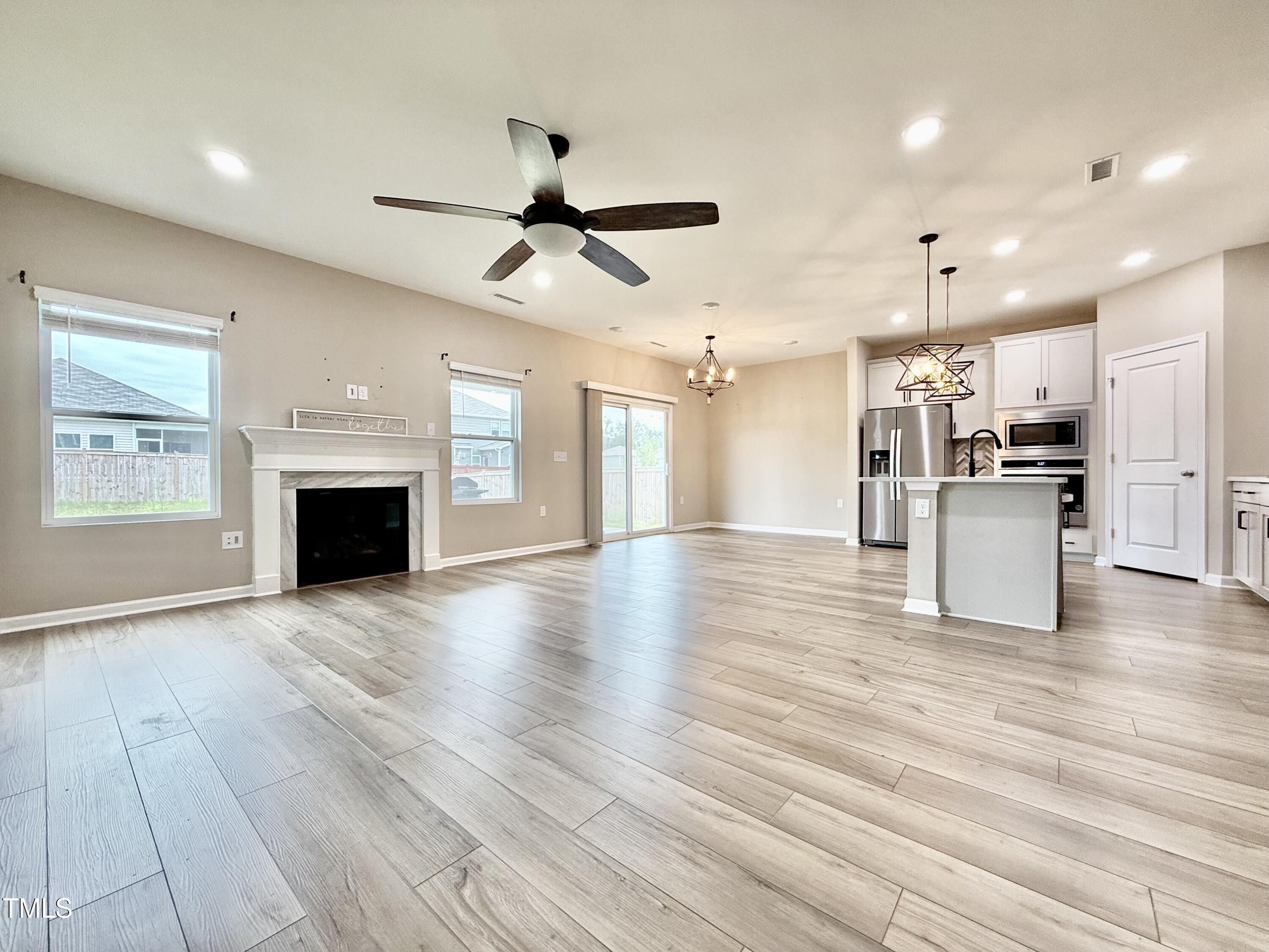 3904 Leeson Trail Raleigh, NC 27616 - Photo 4 of 43 a view of a kitchen with a stove cabinets and wooden floor