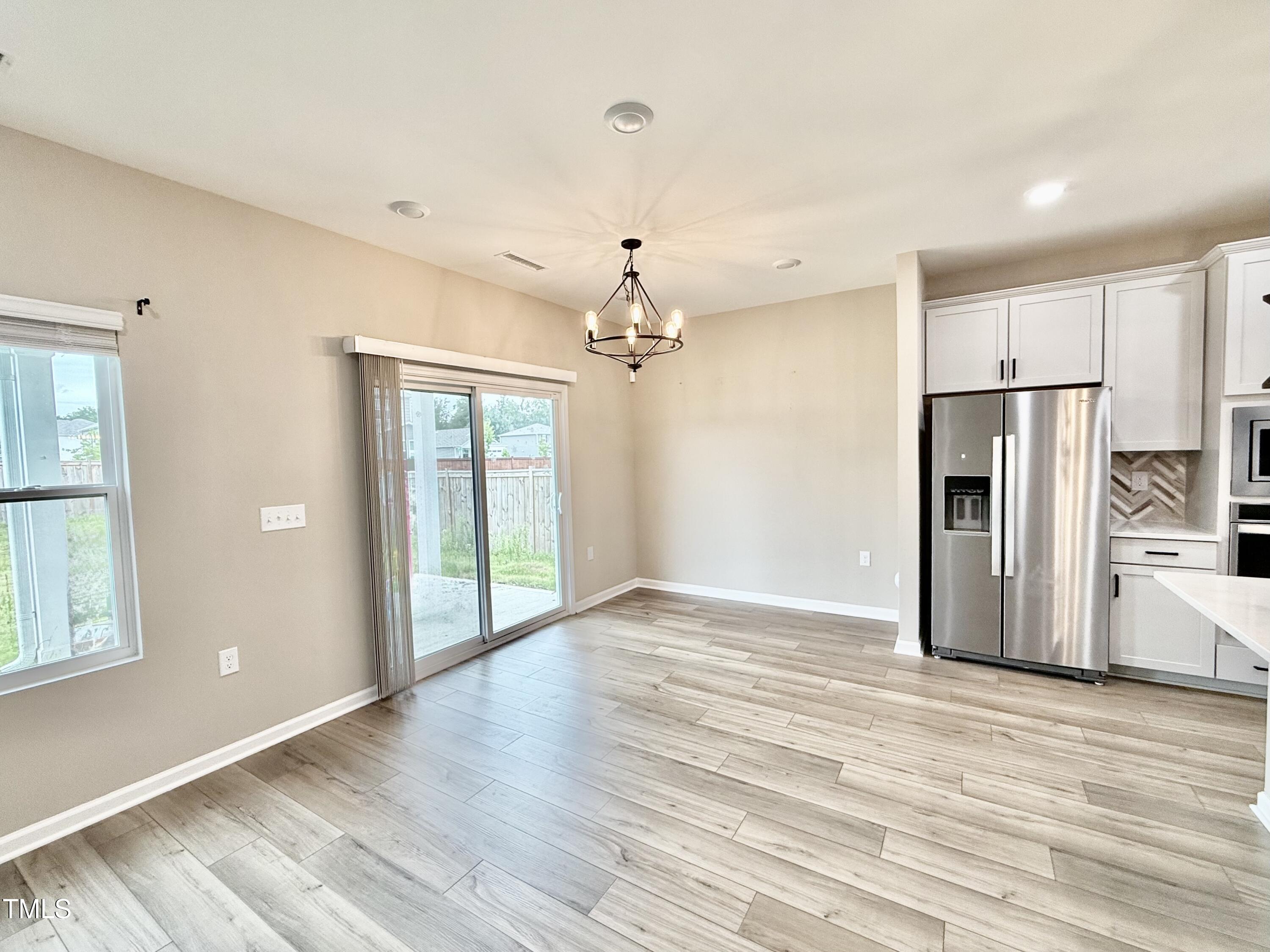 3904 Leeson Trail Raleigh, NC 27616 - Photo 6 of 43 a view of a livingroom with a chandelier